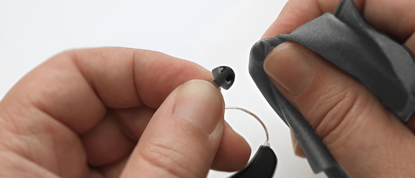 Step-by-step cleaning of behind-the-ear hearing aid tubes for better performance